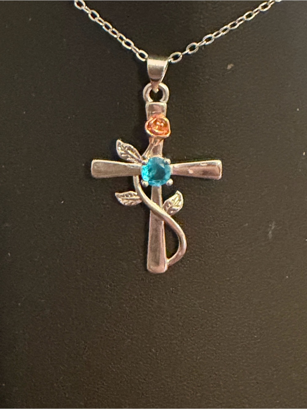 Silver Cross Pendant Necklace with Blue and Orange Gem Accents